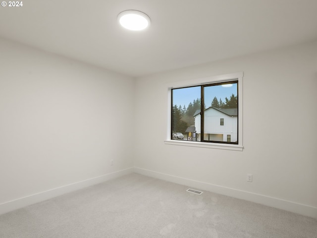 empty room featuring carpet flooring