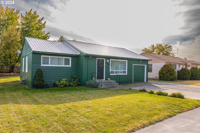 ranch-style house with a front lawn and a garage