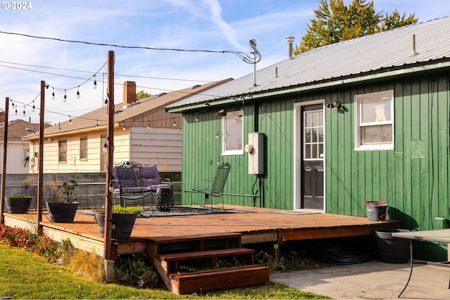 back of house featuring a deck