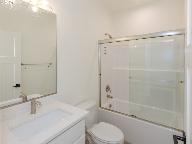 full bathroom with vanity, toilet, and enclosed tub / shower combo