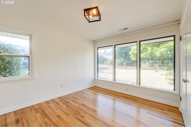 spare room featuring light hardwood / wood-style flooring