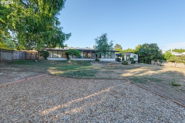 view of front of property with a sunroom