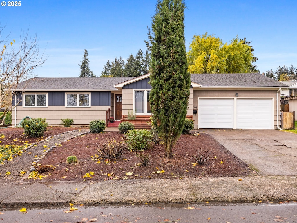 single story home featuring a garage