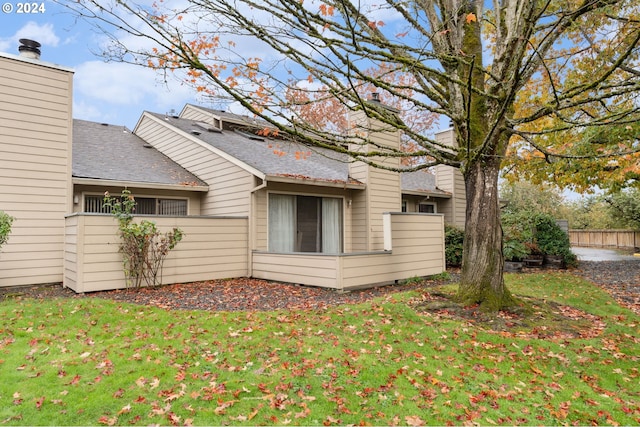 view of home's exterior with a lawn