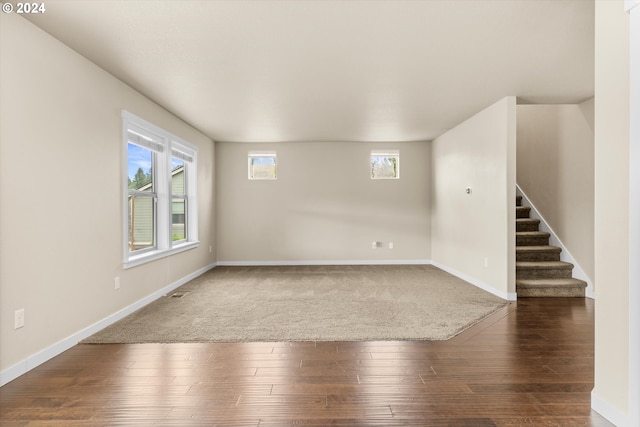 spare room with dark hardwood / wood-style floors