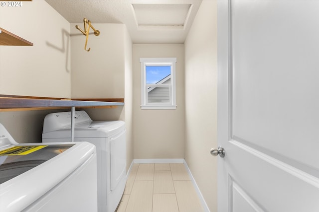 laundry area with washer and clothes dryer