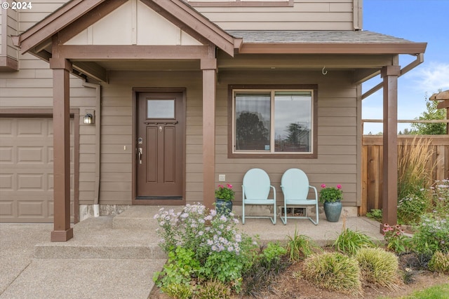 view of exterior entry with a porch