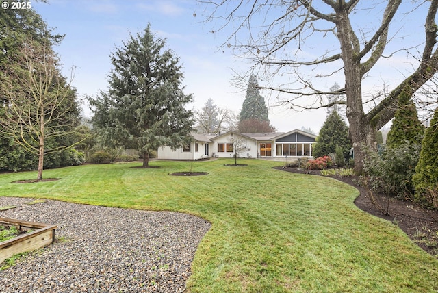 view of yard with a sunroom