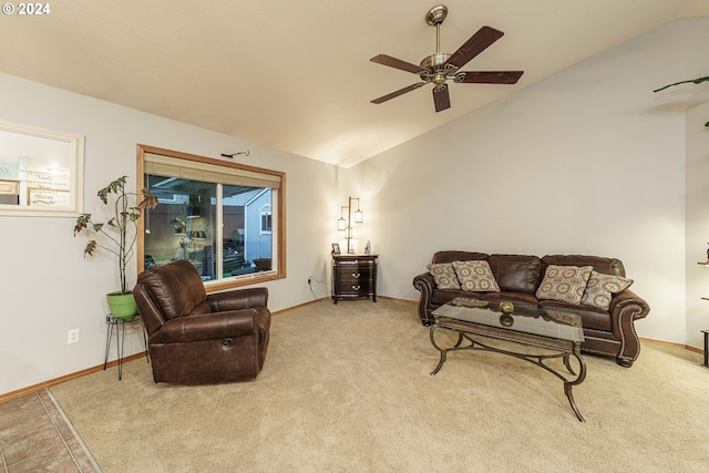 living room with ceiling fan, light colored carpet, and vaulted ceiling