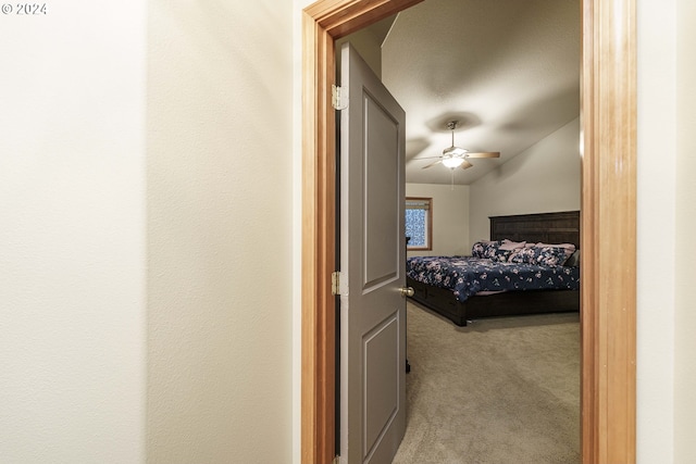 bedroom with ceiling fan and light colored carpet