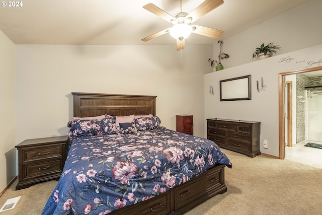 carpeted bedroom with ceiling fan and vaulted ceiling