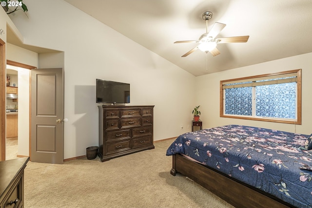 carpeted bedroom featuring ceiling fan and vaulted ceiling