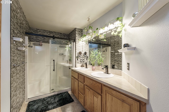 bathroom featuring tile patterned flooring, vanity, and walk in shower