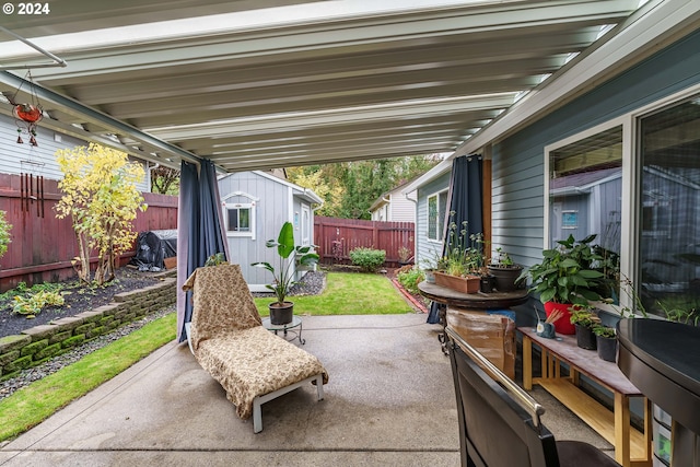 view of patio / terrace featuring a storage shed