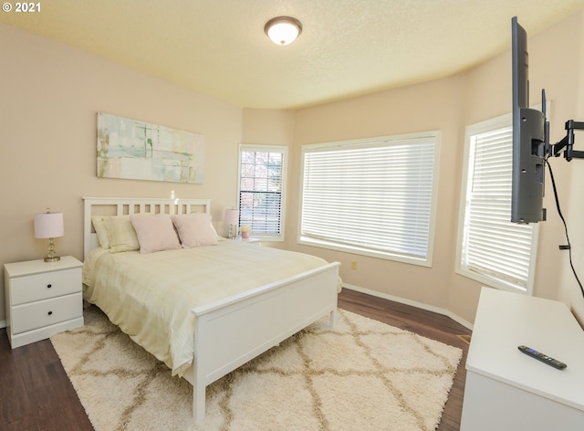 bedroom with hardwood / wood-style floors