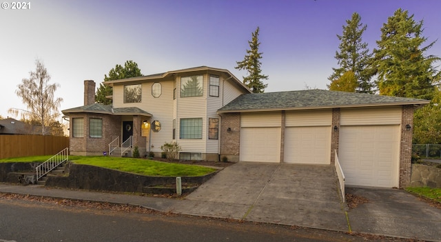 view of front property featuring a front yard and a garage