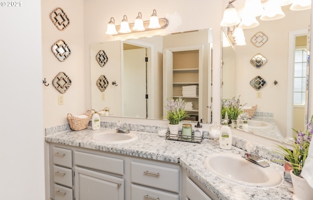 bathroom with dual bowl vanity