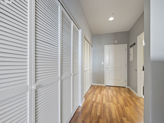 hall with light hardwood / wood-style floors