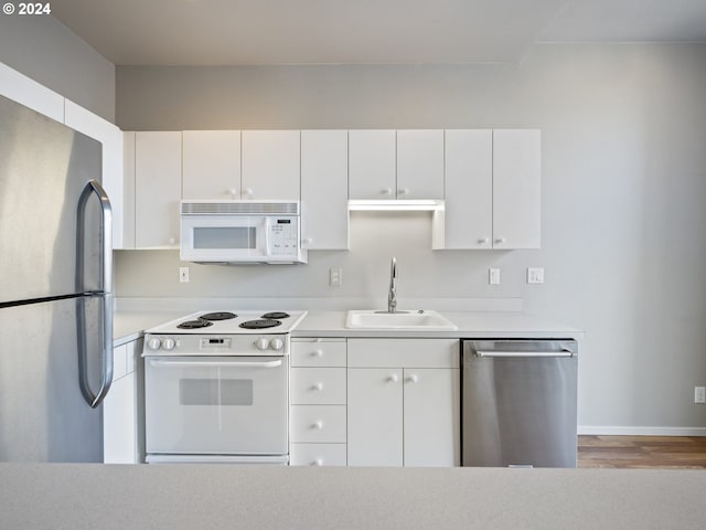 kitchen with white cabinets, sink, and stainless steel appliances