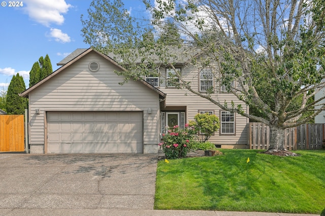 view of front facade featuring a front lawn and a garage