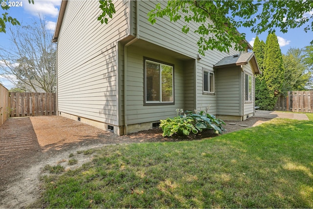 view of home's exterior featuring a lawn