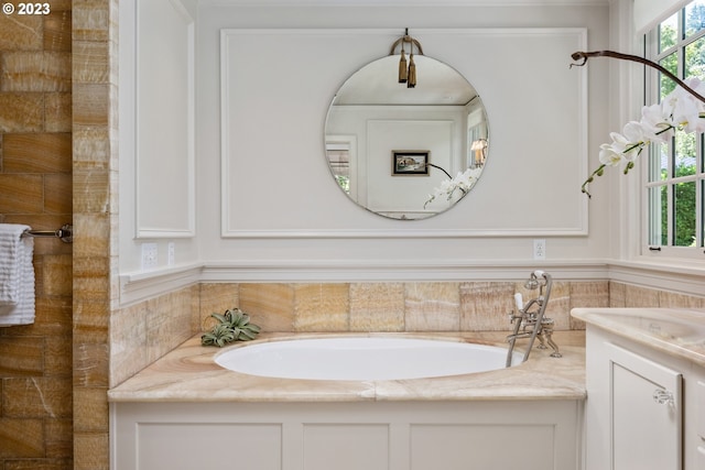 bathroom featuring vanity and a bathtub