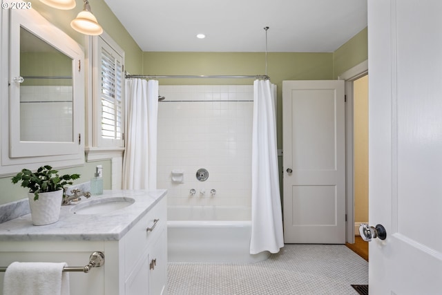 bathroom with tile patterned floors, vanity, and shower / bathtub combination with curtain