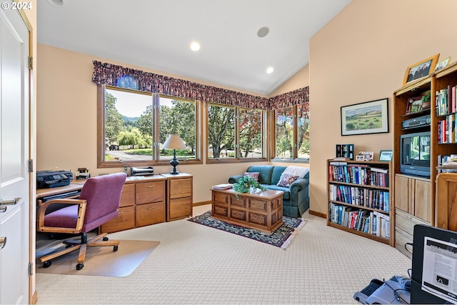 carpeted office featuring lofted ceiling