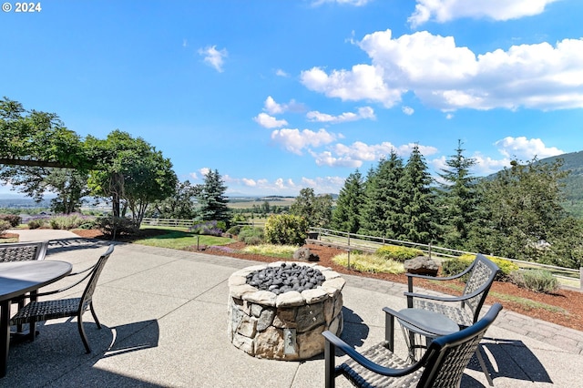 view of patio / terrace with an outdoor fire pit