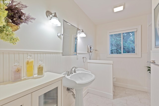 bathroom featuring tile patterned floors, toilet, and sink