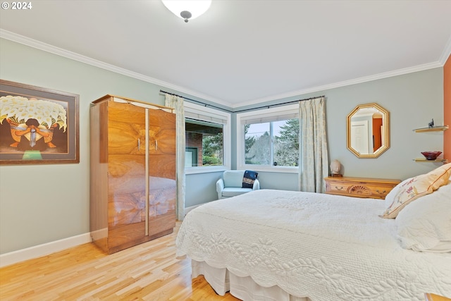 bedroom with a closet, wood-type flooring, and ornamental molding