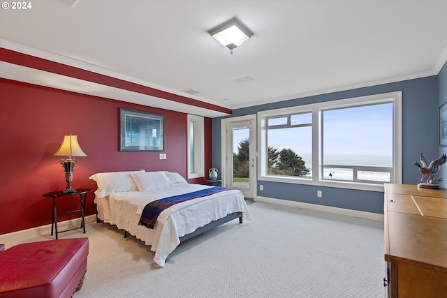 bedroom with ornamental molding, a water view, light colored carpet, and access to outside