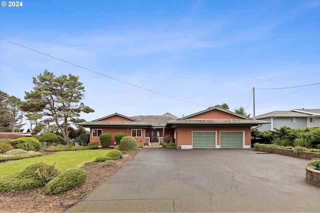 ranch-style house with a front lawn and a garage