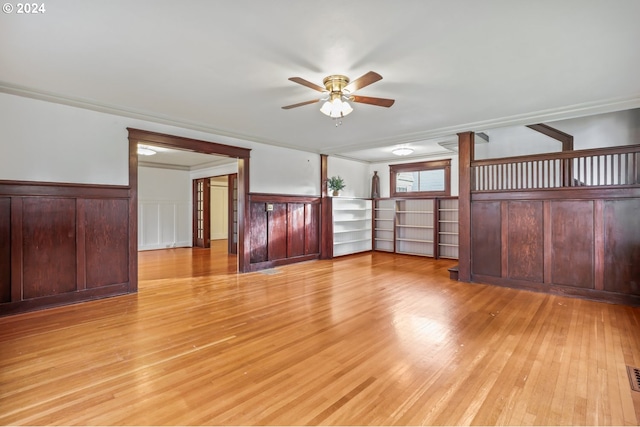 interior space featuring light hardwood / wood-style flooring, ceiling fan, and ornamental molding