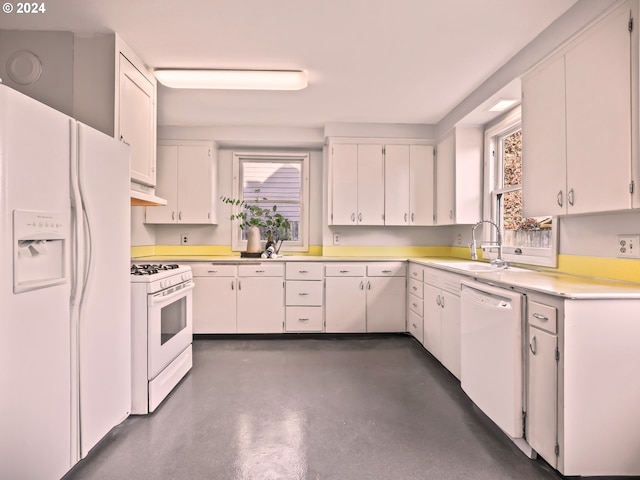 kitchen featuring white cabinets, a healthy amount of sunlight, and white appliances