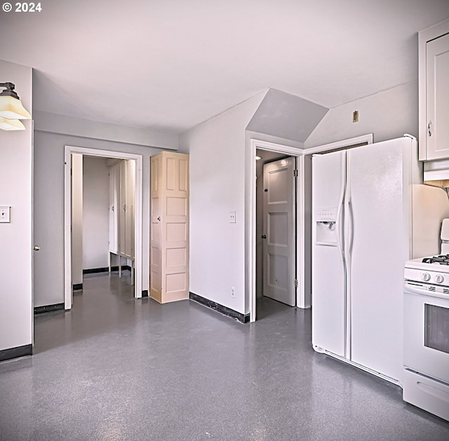 kitchen featuring white cabinets and white appliances