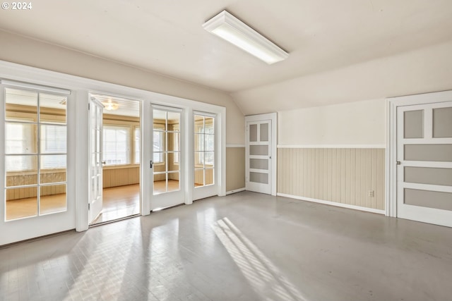 spare room with vaulted ceiling