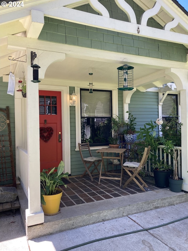 doorway to property with a porch