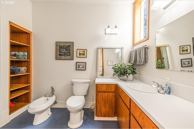 bathroom with vanity, a bidet, toilet, and tile patterned flooring