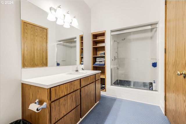 bathroom with vanity, tile patterned flooring, and walk in shower