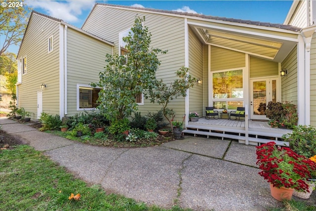 view of side of home with a deck