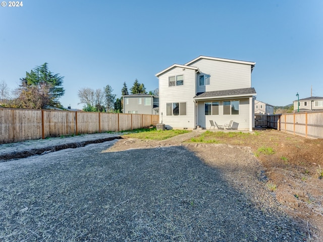 back of house featuring a patio and central AC