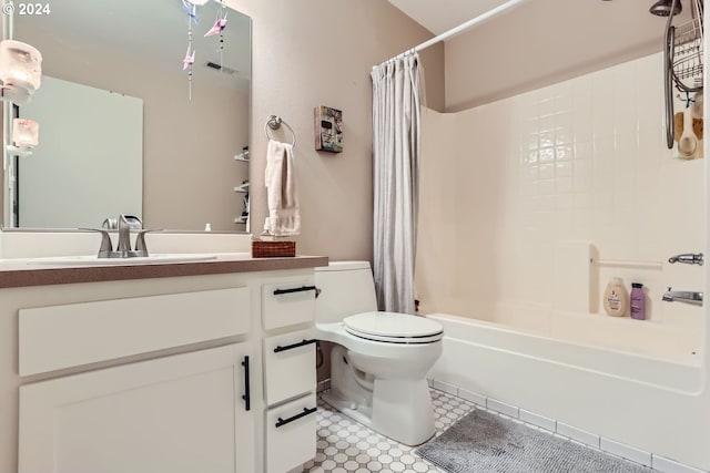 full bathroom featuring tile patterned flooring, shower / bath combo, toilet, and vanity