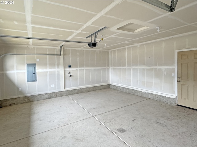 garage featuring electric panel and a garage door opener