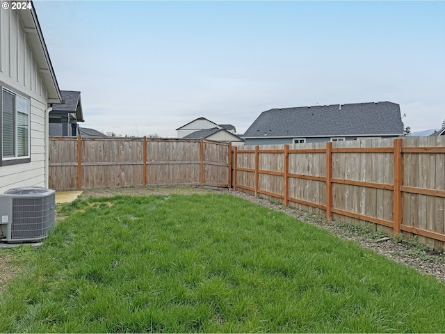 view of yard with central AC unit