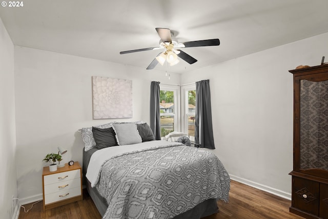 bedroom featuring ceiling fan and dark hardwood / wood-style flooring