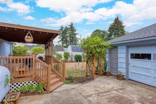 exterior space featuring a garage and an outbuilding