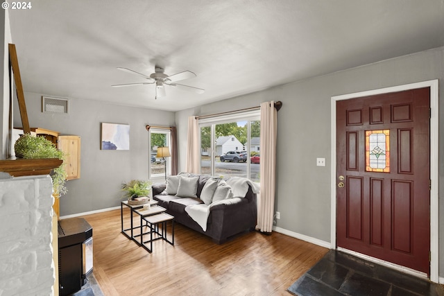 interior space with ceiling fan and dark hardwood / wood-style floors