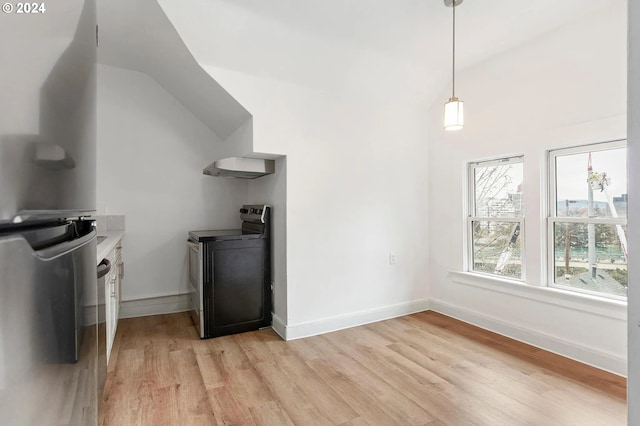 interior space featuring light hardwood / wood-style floors and vaulted ceiling