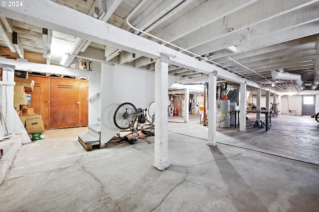 basement featuring electric water heater